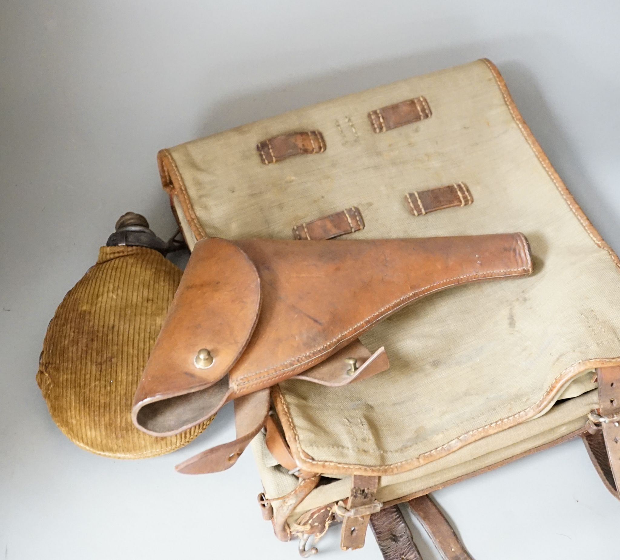 Miscellaneous WWI accessories including a water bottle, and a WWII Japanese pilot's cap